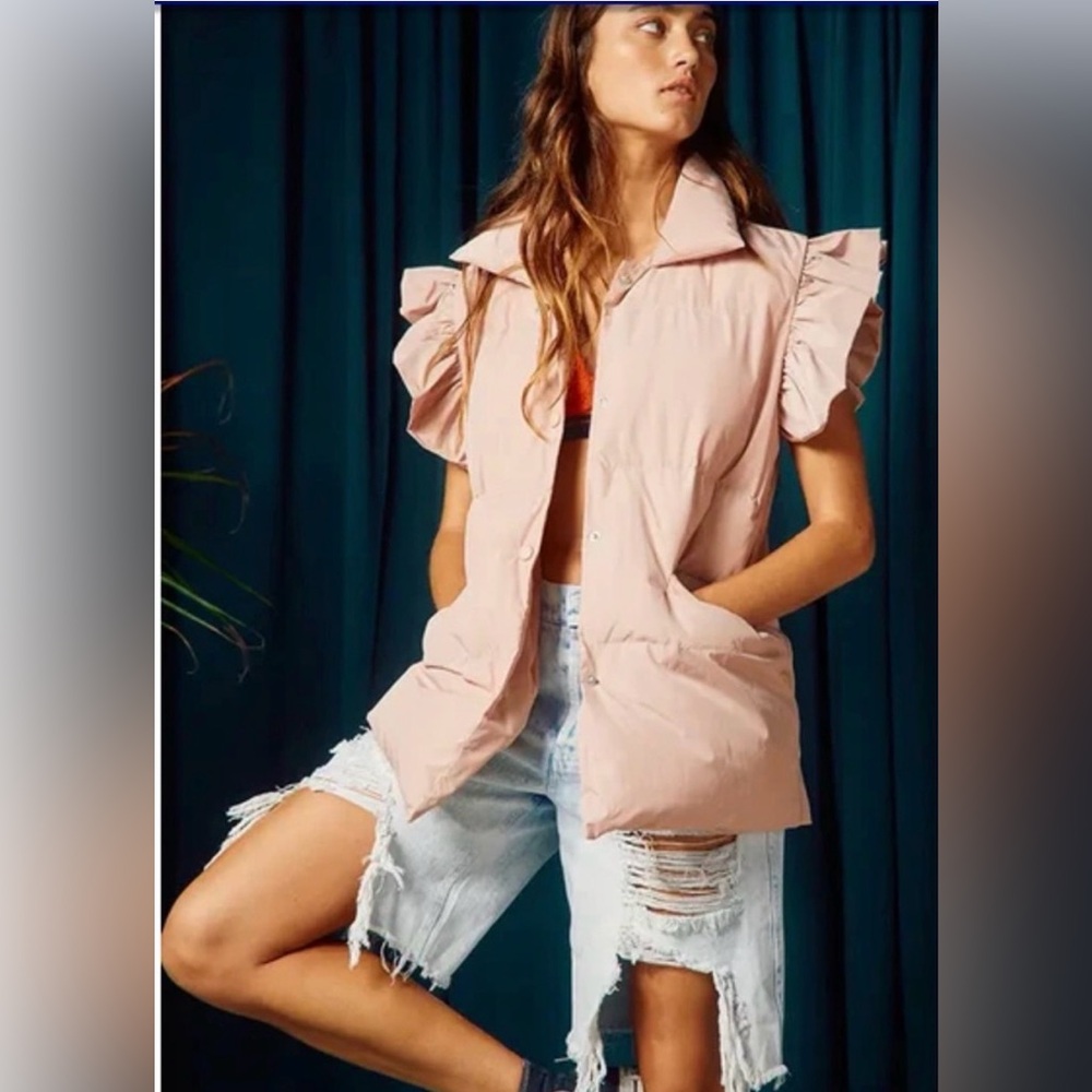 New Bucket List down vest offers ruffle sleeves detail w/ snap button closure.